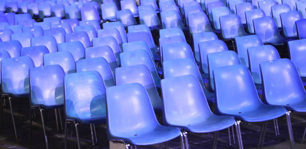 istock empty blue plastic chairs without people before the start of a live concert 2175180170