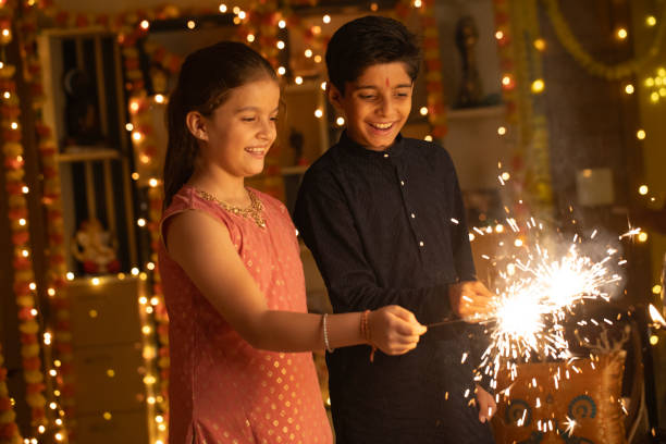 istock Sibling burning sparklers at home during Diwali 2175187412
