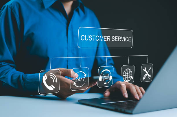 istock Customer Service Concept. Businessman interact with digital icons representing customer service tools like phone support, 24/7 service, online chat, and technical support while working on a laptop. 2175194618