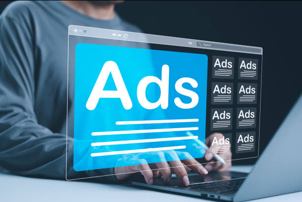 istock Analyzing Online Advertising Campaigns. A person using a laptop with multiple digital Ad windows on screen symbolizes online advertising analysis and campaign management. AD on website, Ads campaign, 2175194621
