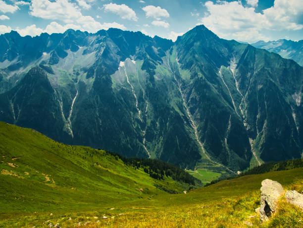 View on jagged mountains of Zillertal alps on a summer day,mountains, rocks, blue sky, clouds.  Zillertal alps/Zillertaler alpen, Austria.