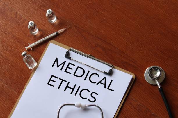 istock Paper clipboard with text MEDICAL ETHICS and stethoscope. 2175197431
