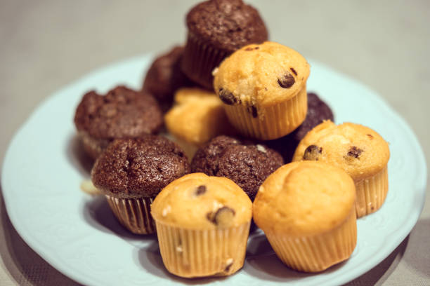 Sweet chocolate and vanilla muffins on a plate - selective focus - food concept