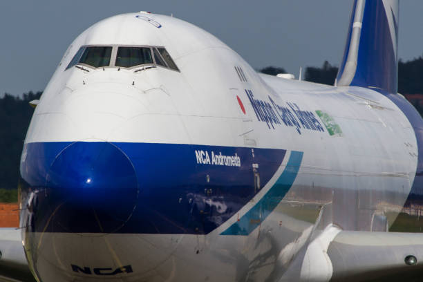 Cargo plane Boeing 747 of Nippon Cargo Airlines lining up the runway in Graz, Austria Graz, Austria - May 17, 2016: Huge cargo plane Boeing 747 of Nippon Cargo Airlines lining up the runway in Graz, Austria nippon cargo airlines photos stock pictures, royalty-free photos & images