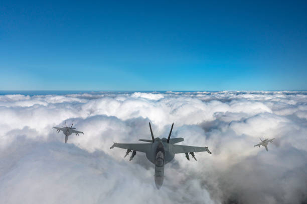 istock Modern fighters jet flying over clouds.  F-18 Hornet over clouds. 2175210212