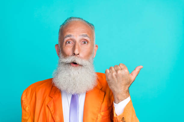 istock Photo of impressed elegant man indicate thumb empty space offer isolated on teal color background 2175213071