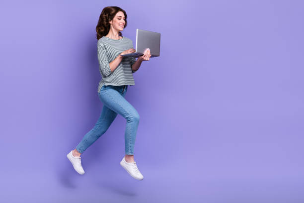 istock Full length photo of hardworking successful lady addicted user moving empty space hurry work isolated on purple color background 2175214916