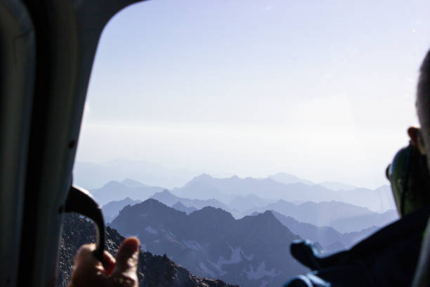 istock Tourist admiring the Alps during a flight 2175215630