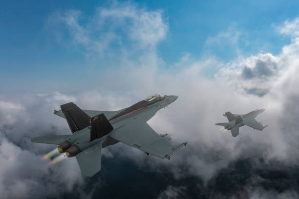 istock Modern fighters jet flying over clouds.  F-18 Hornet over clouds. 2175216541
