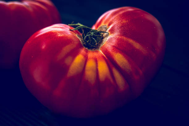 Close-up view of a pile of fresh red tomatoes