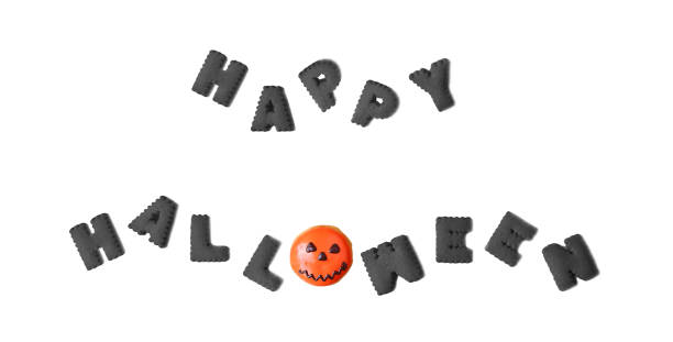 HAPPY HALLOWEEN typography in black alphabet cookies shaped and Jack O' lantern bun on white Backdrop