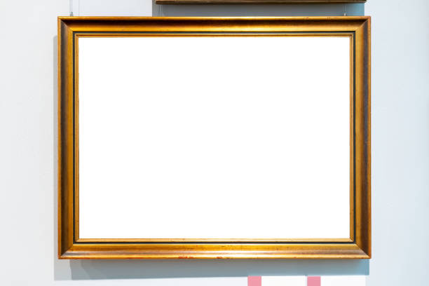 istock Plain simple middle size blank empty gold painting frame, hanging on a art museum gallery wall, middle cut out, rectangle picture copy space template mockup. Object front view, frontal shot, no people 2175228380