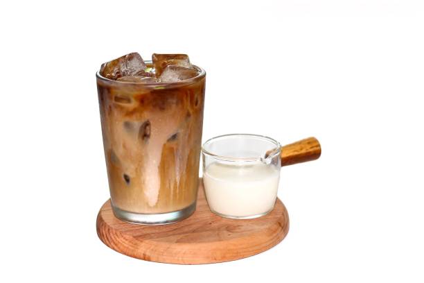 istock Latte ice coffee serving with pouring milk for topping and put on white background with isolated style. 2175233363