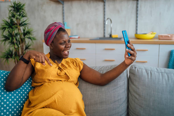 istock Pregnant woman having a video call 2175236369