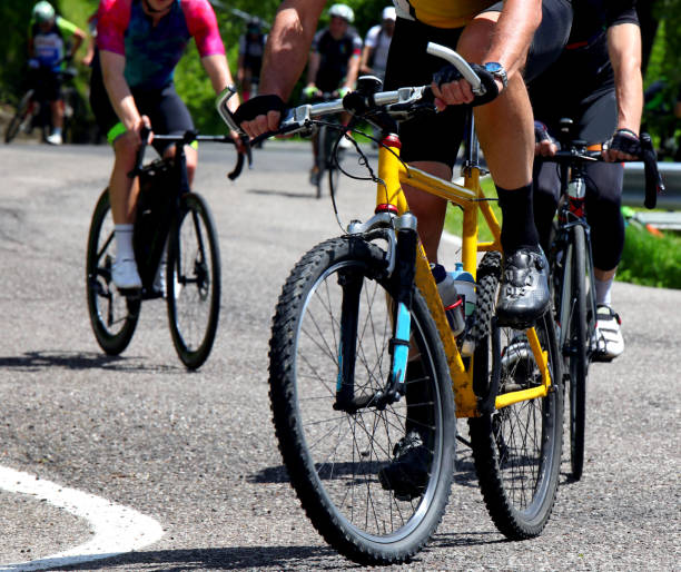 istock cyclists with gravel bikes during competitive mixed terrain cycling race 2175238884