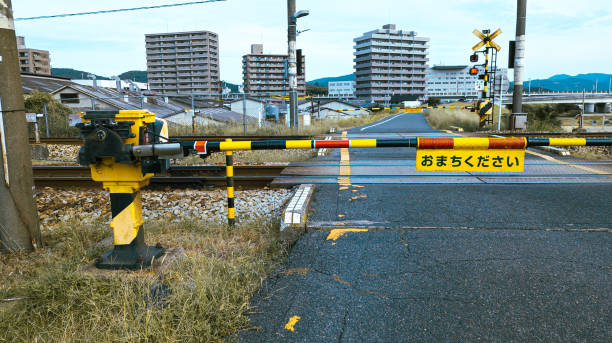 istock Japanese Tran on Railroad Crossing 2175239939