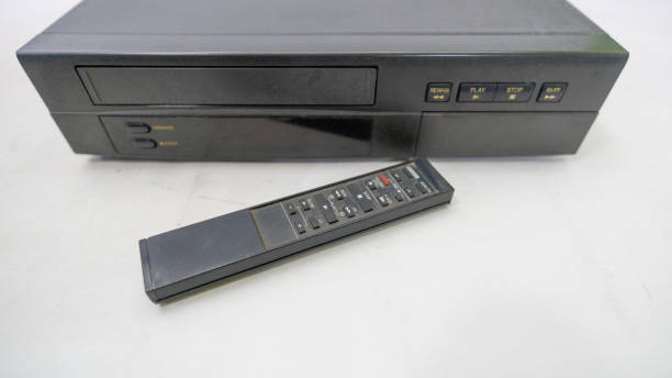 Old VCR type video player with remote control and old tapes