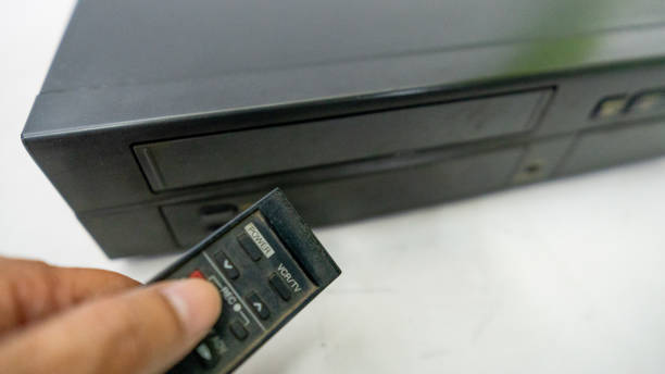 istock VCR with old VHS tapes and remote control 2175248352