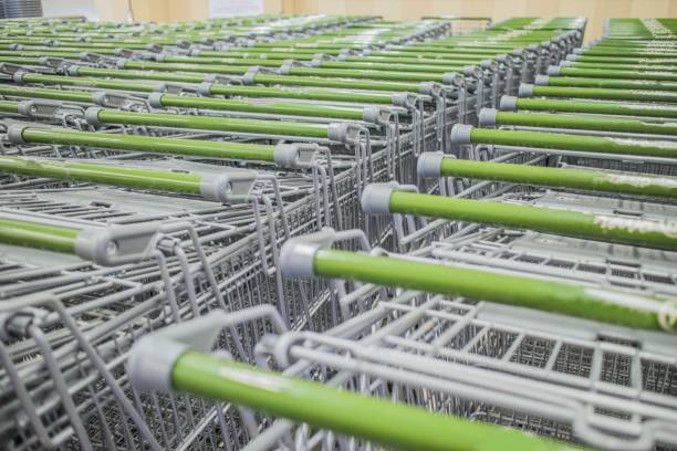istock Rows of empty shopping carts in a supermarket 2175253729