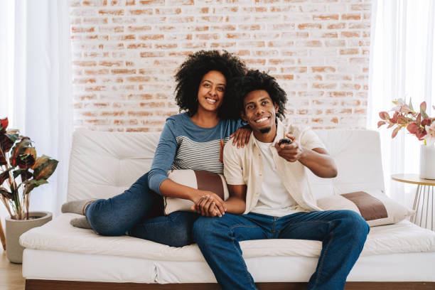 istock Happy couple watching tv 2175259302
