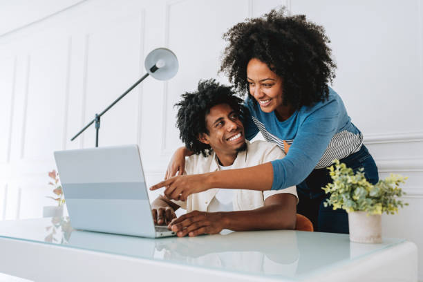 istock Woman using laptop at home 2175259933