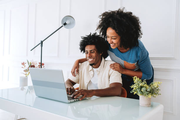 istock Woman using laptop at home 2175259945