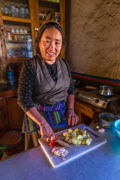 istock Tibetan woman preparing meal, Upper Mustang, Nepal 2175265831