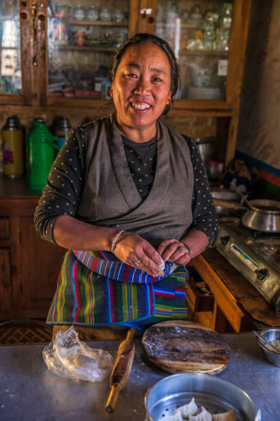 istock Tibetan woman preparing momos, Upper Mustang, Nepal 2175266518