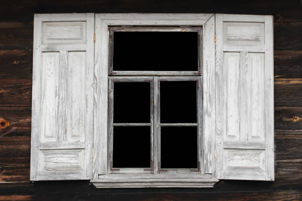 istock Old wooden window with peeling white paint in rustic architecture. Shutters with worn paint. 2175270459