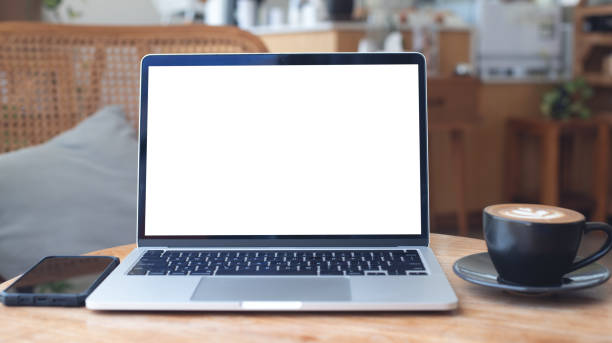 istock Mockup, laptop blank screen on wood table with coffee cafe background, template for your text advertisement, front view 2175286401