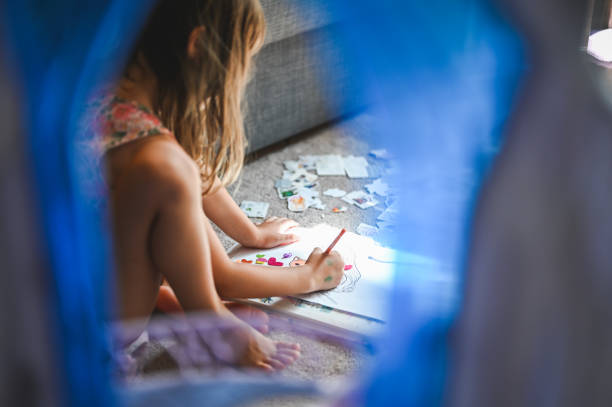 Girls coloring at home.