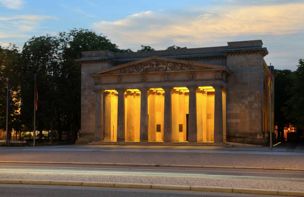 Berlin, Germany, July 5, 2024: View of the New Guard Building (German: Neue Wache) on the street Unter den Linden in Berlin in the evening. Originally it was built as a guardhouse for the troops of the Crown Prince of Prussia. Since 1931 the building has been used as a war memorial.