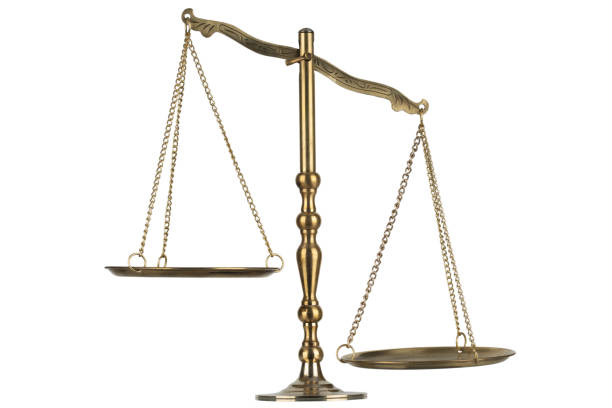 istock Bronze traditional balance scale with weights isolated on white 2175293416