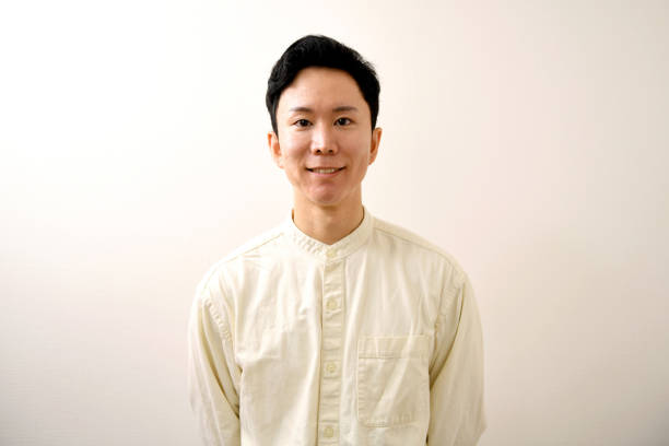 istock Smiling young Asian man in casual clothes looking at camera 2175297191
