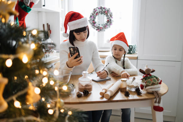 istock Mother and daughter preparing for Christmas in cozy kitchen 2175297230