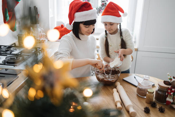 istock Mother and daughter baking Christmas cookies in kitchen 2175297277