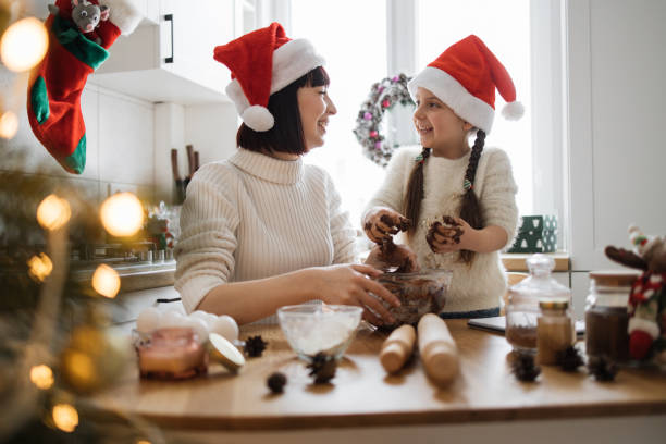 istock Mother and daughter baking together for Christmas celebration 2175297293