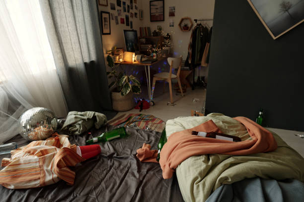 istock Creased clothes and empty bottles on bed 2175297853