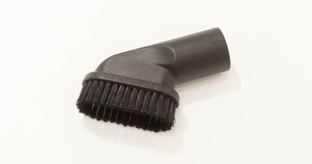 istock Black vacuum cleaner brush attachment for cleaning surfaces, close up on white background. 2175298208