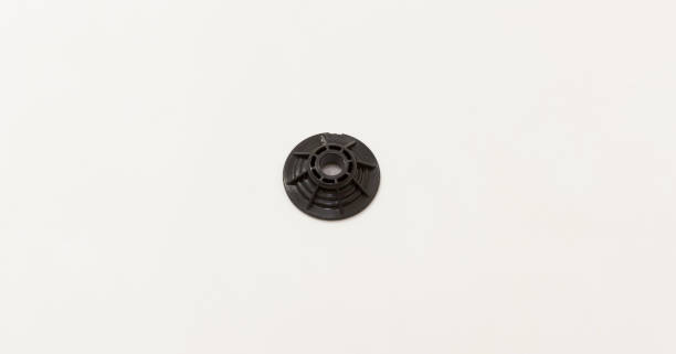 istock Black plastic washer with central hole on white background, used in mechanical or industrial applications. 2175298328