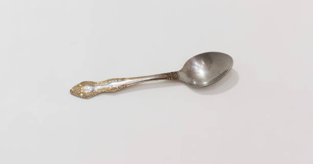 istock Elegant silver spoon with ornate, intricate design, ideal for vintage collections or culinary photography. 2175298912