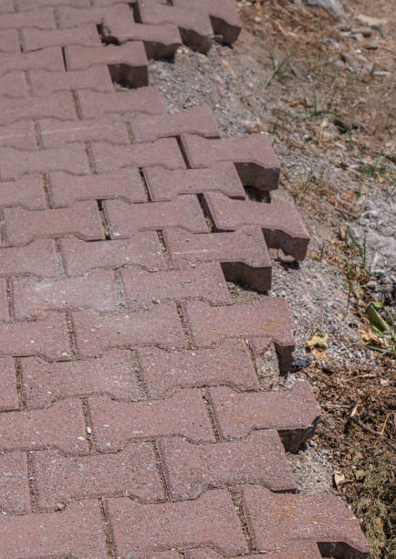 istock damaged and deteriorated concrete paving road. 2175305984