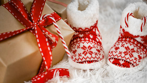 istock Christmas Gift and Cozy Slippers 2175307440