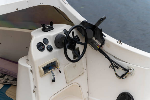 istock Boat dashboard and steering wheel captured during a calm evening 2175307514