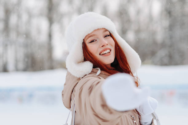istock young redhead girl in ice rink 2175307560