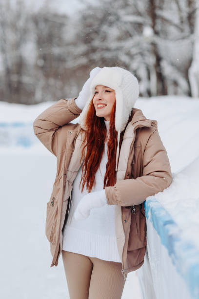 istock young redhead girl in ice rink 2175307589