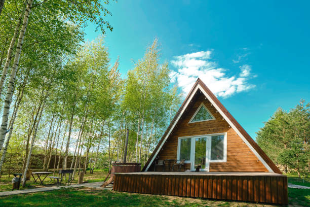 istock Cozy wooden cabin in a serene forest setting during a sunny day 2175307831