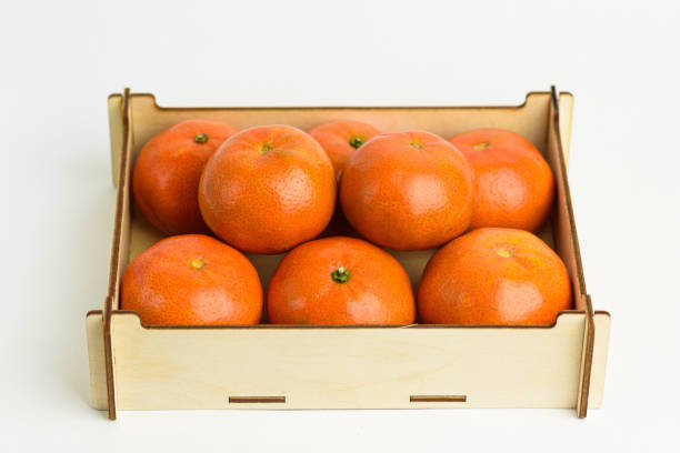 Basket with many tangerines on the street for sale in a greengrocer's shop