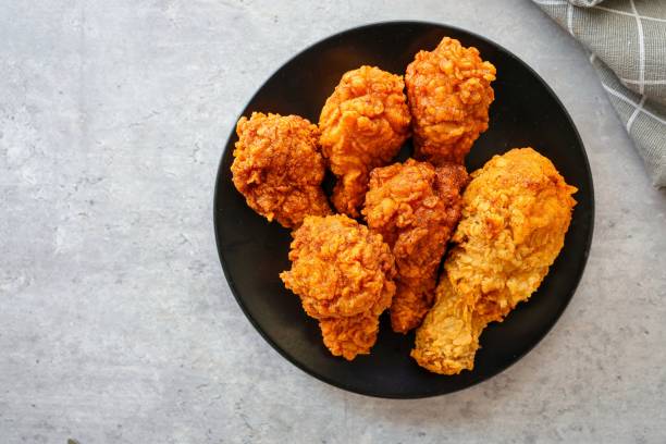 istock Crispy Fried chicken in  black plate  on grey background , top view food table with free copy space 2175323243