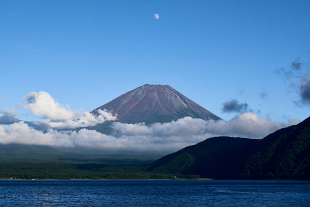 istock Mount Fuji with clouds and the moon 2175327100